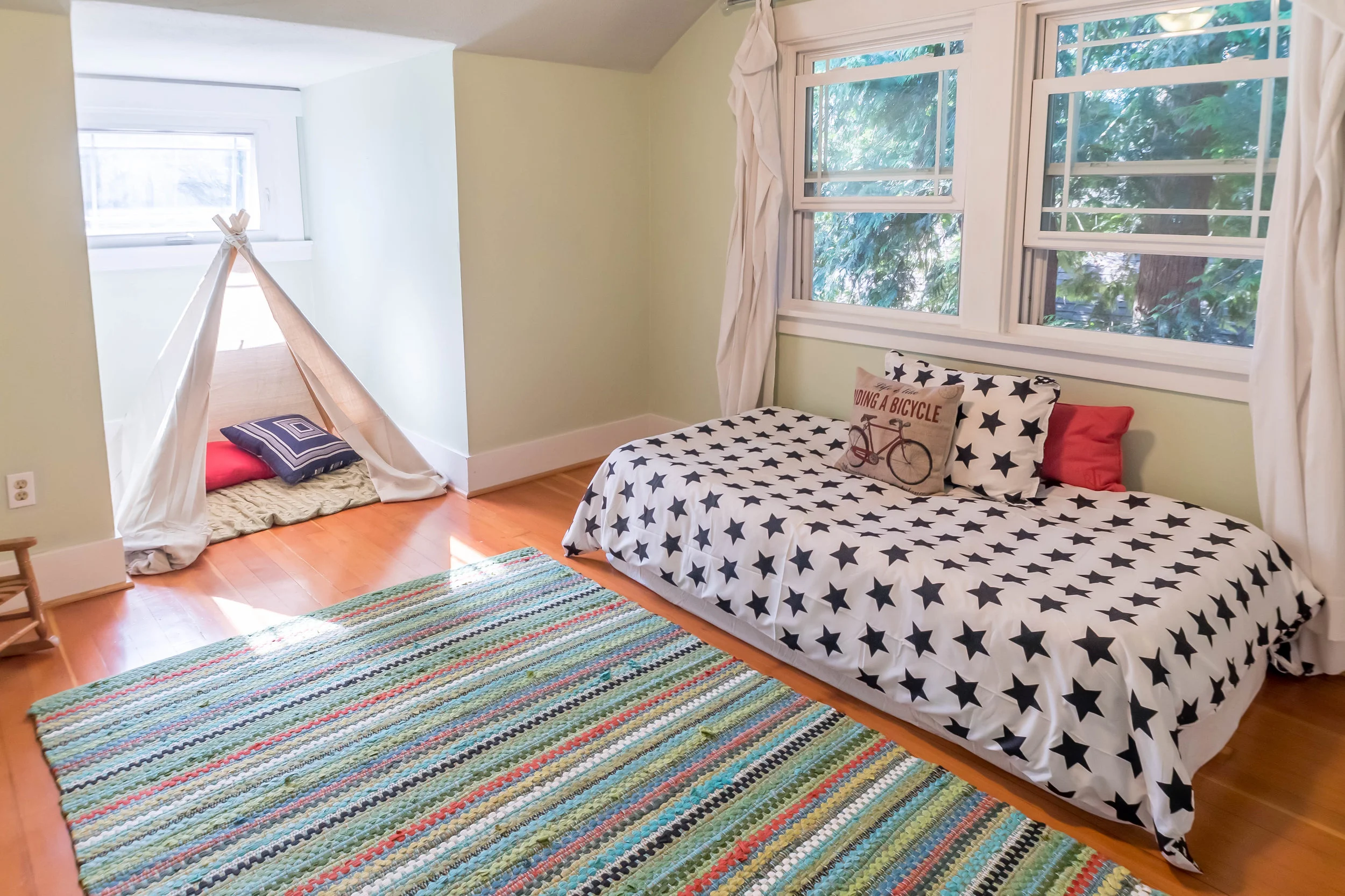 Upstairs bedroom with pretty windows and lovely light.