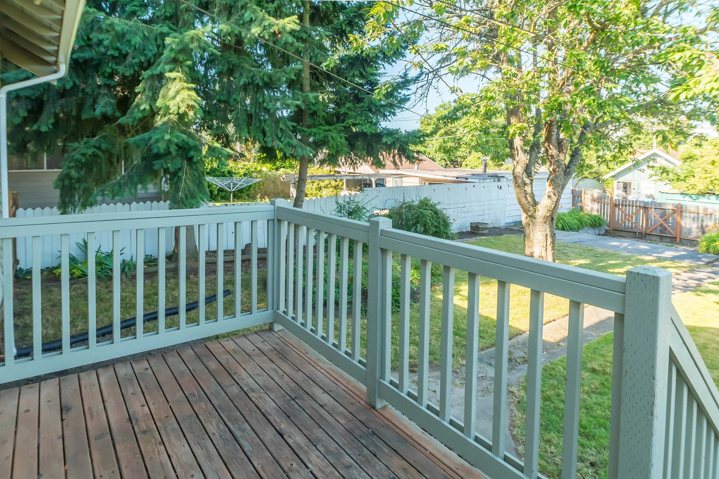 Backyard deck accessed through convenient mudroom. 