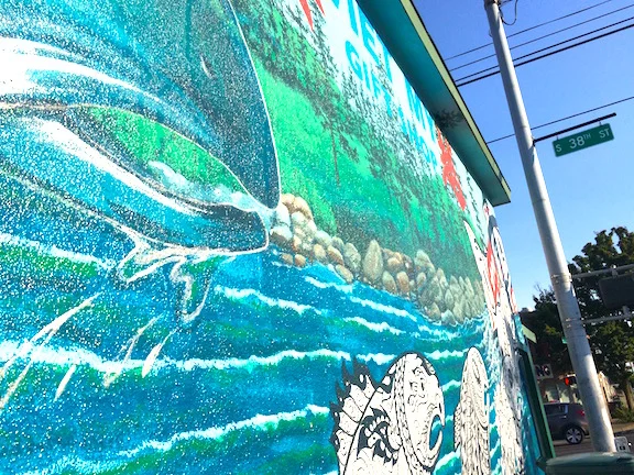 Bob Henry's leaping salmon mural on the corner of S. 38th St and S. Yakima Ave.