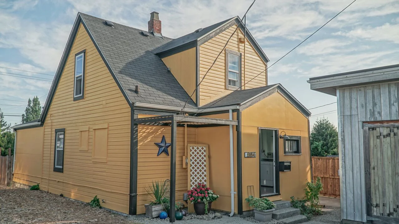 Alley entrance with parking and garage access.