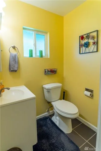 Cheerful and clean half bath.