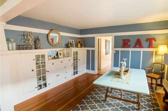Beautiful dining room with built-in cabinets to display heirlooms, and favorite dishes. 
