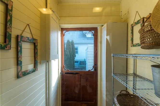 Classic mud room leads into kitchen from the backyard. 