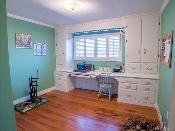 Wonderful built-ins, and a closet with shelves make this an ideal third bedroom or studio. 