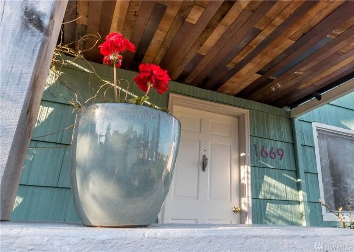Front porch with reclaimed fir floor boards for ceiling. 