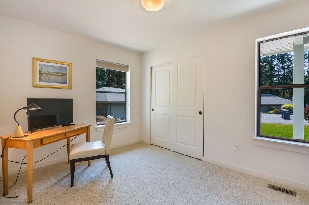 A second bedroom at the front of the house includes a spacious closet, good window light, and would also make a nice office, den, sewing room, or combination.