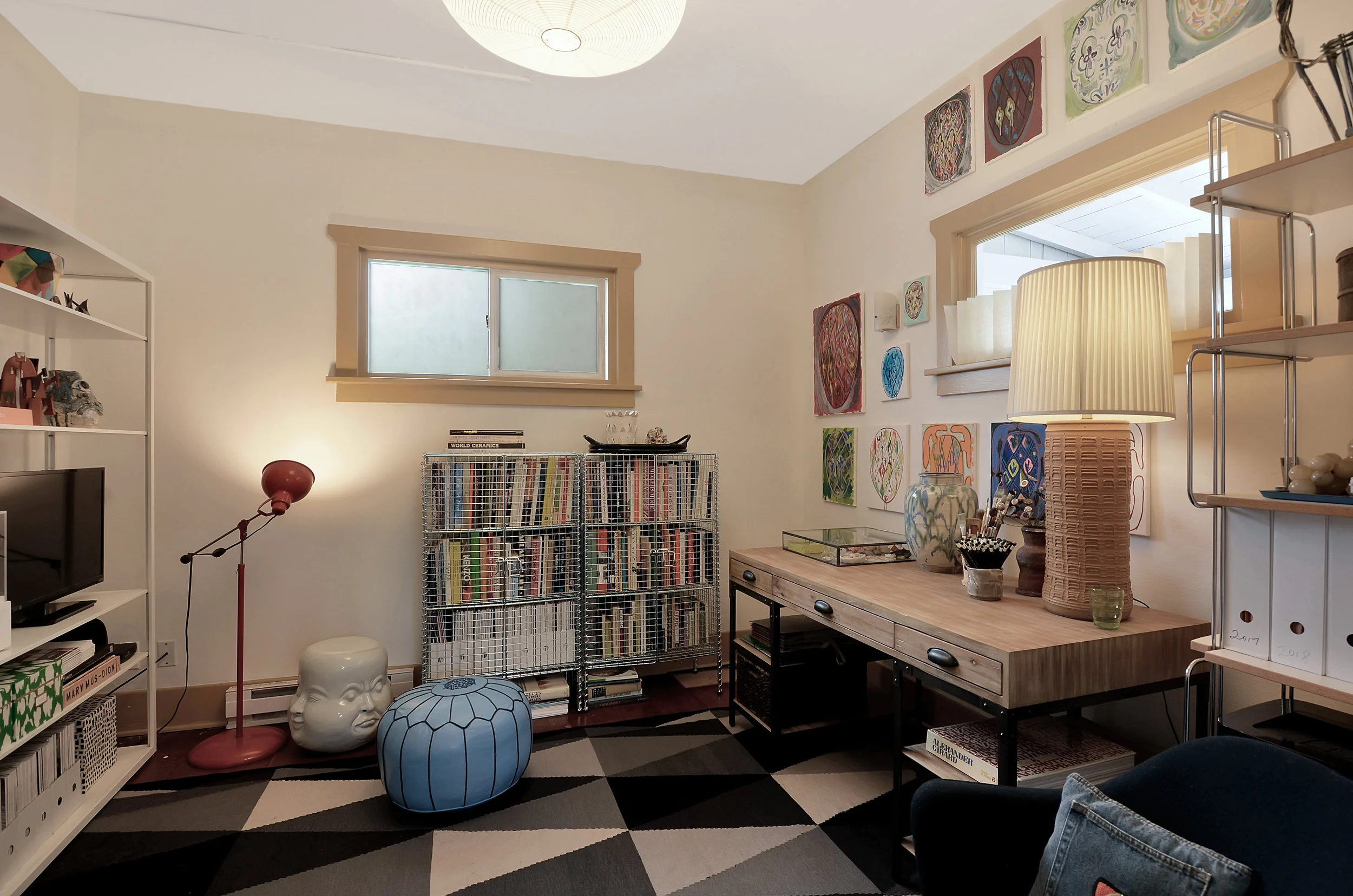 If 3 bedrooms are on the menu for you, go ahead and set this room up with the traditional beds, dresser, and little desk. If you have bedrooms to spare, you might find yourself having fun with this room, taking a few weeks to discover its purpose in your home. Here, the room is set as a home office and library space with room to sketch, write, and get organized. No matter how you use it, it’s a nice room and the bathroom is just a few steps away down the hall.