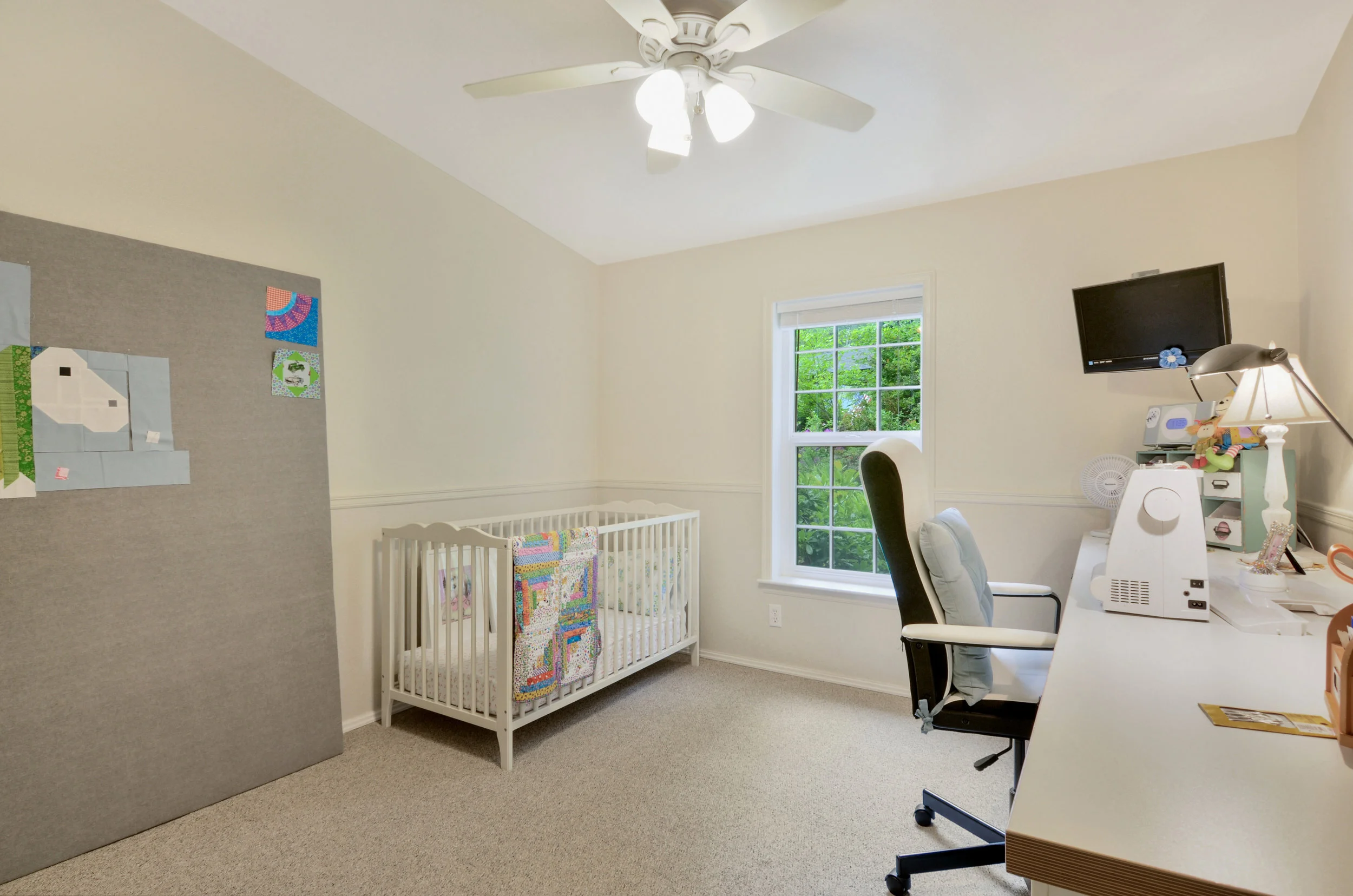 The 3rd of the three bedrooms, this one is set up as a nursery and sewing room. You can use it as a regular bedroom, craft room, guest room, or office depending on the needs and size of your family.