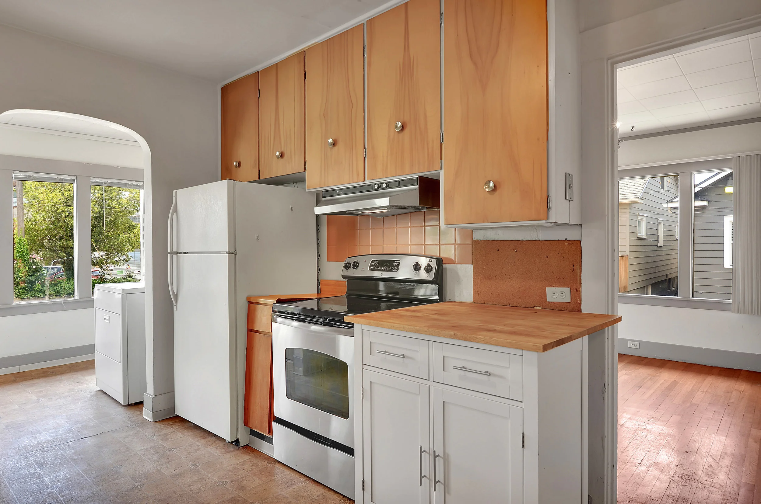 Here you get a better sense of how the kitchen leads to the dining room on the right and the laundry area on the left.