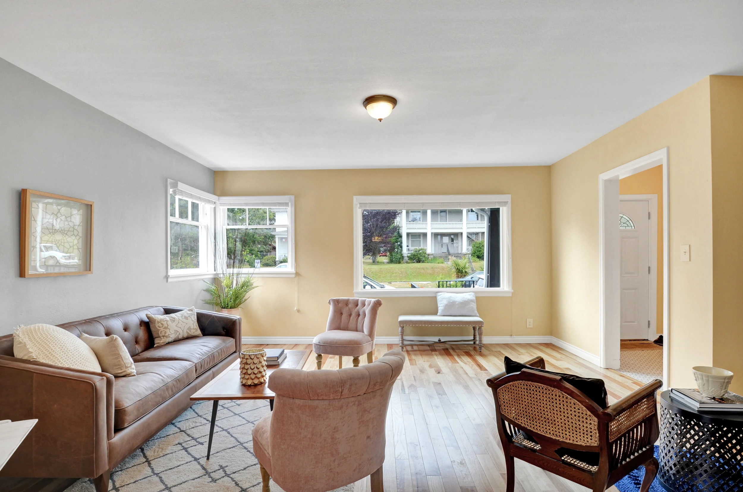 Living room windows overlook North K St, bringing light in from the front and corner.