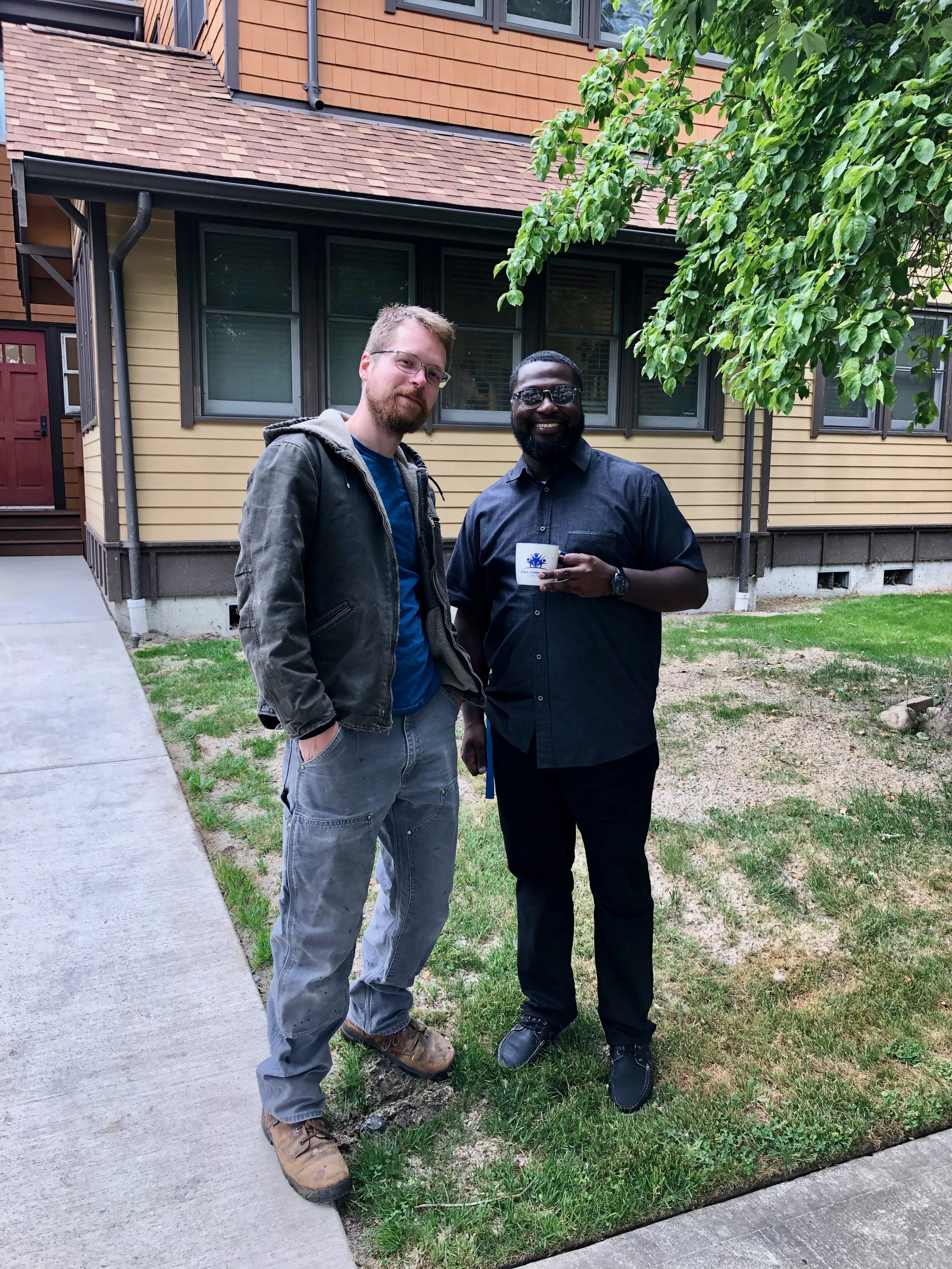Brendan Nelson poses with Aaron Skwirut on the future site of the Peace Little Free Library.