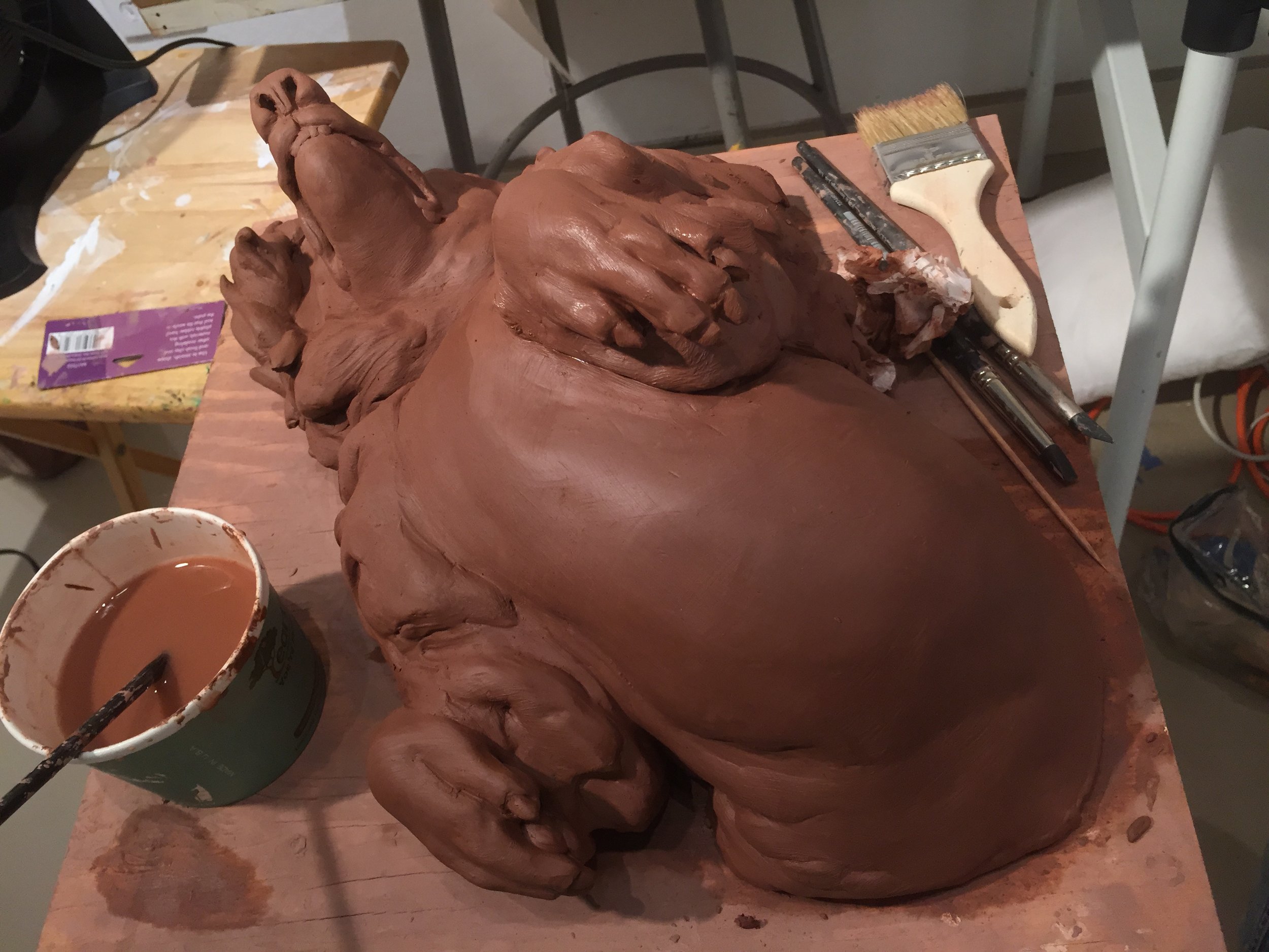 I work mainly in water base clay for my sculptures. This forgiving material allows for a quick build up of forms. This is a sculpture that I am currently detailing and preparing for the mold making step. The mold allows the sculpture to live in different materials, I was thinking to make this one in particular in porcelain.
