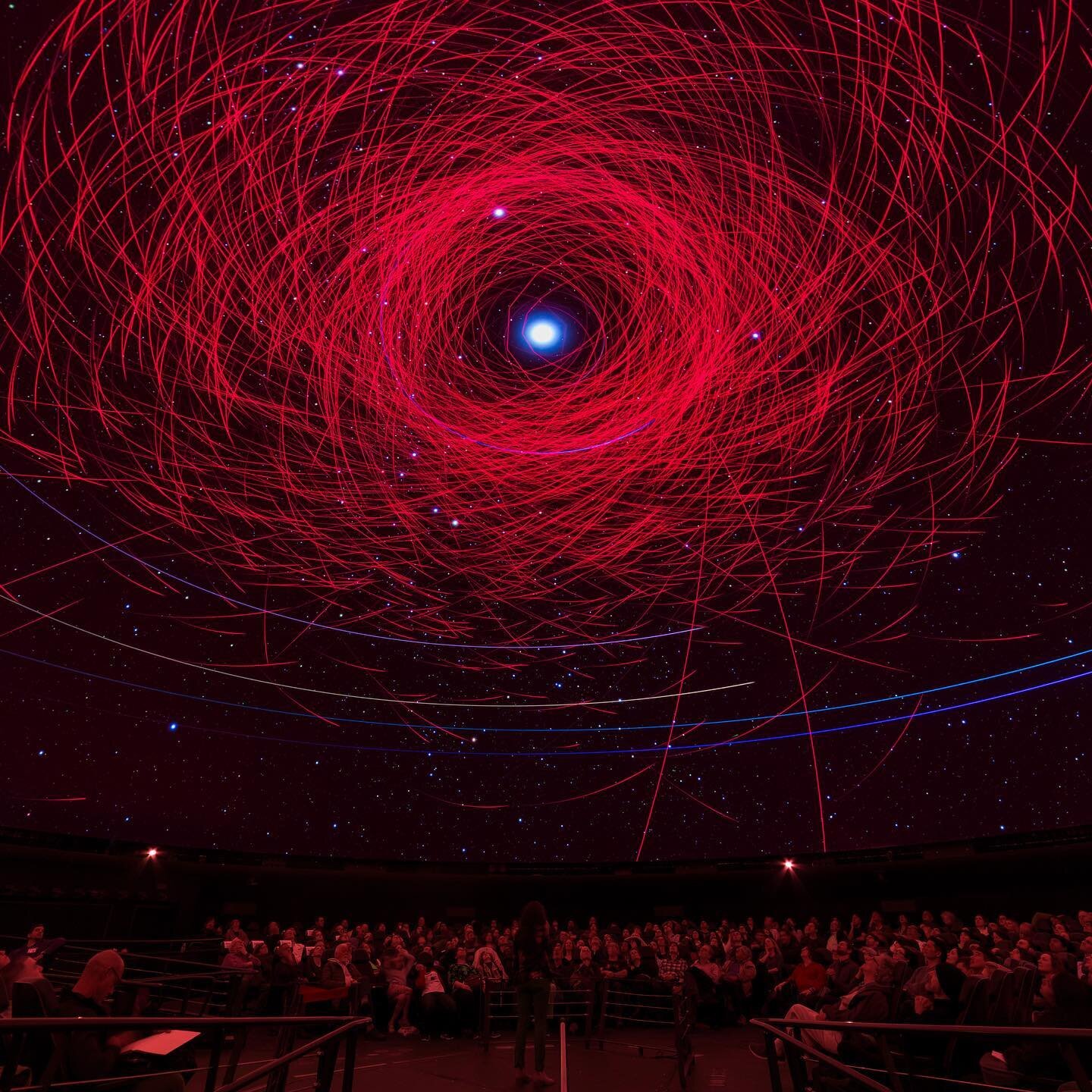 Another shot captured by @matt.shanley during my Cosmic Ballet presentation in 2020.  Probably the last live show that we did inside the Hayden Planetarium before the pandemic shut the theatre down.  The swarm of red lines represent hazardous asteroi