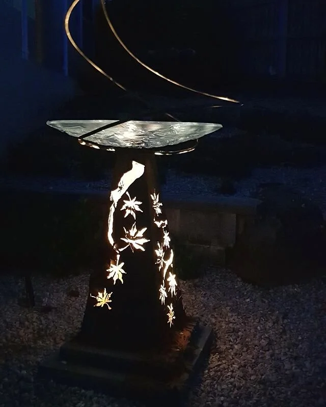 Always wonderful to receive images from happy clients. The light projected Japanese maple motif up through the slumped glass dish is just stunning. Custom made birdbath- a very special surprise gift. #gardenart #birdbath #bespoke #instatas #landscapedesign