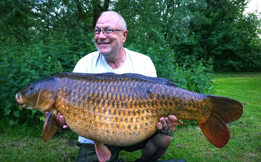 The grin says it all - 44lb 11oz of Oxon common