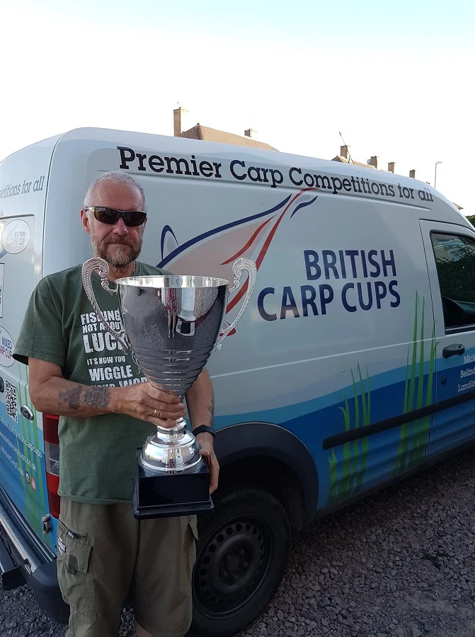 Mick Coxon with the trophy for next year's event