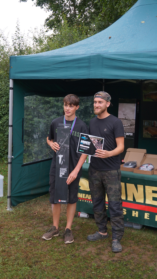 Tom Dove giving Adam Biddulph his biggest-fish prize