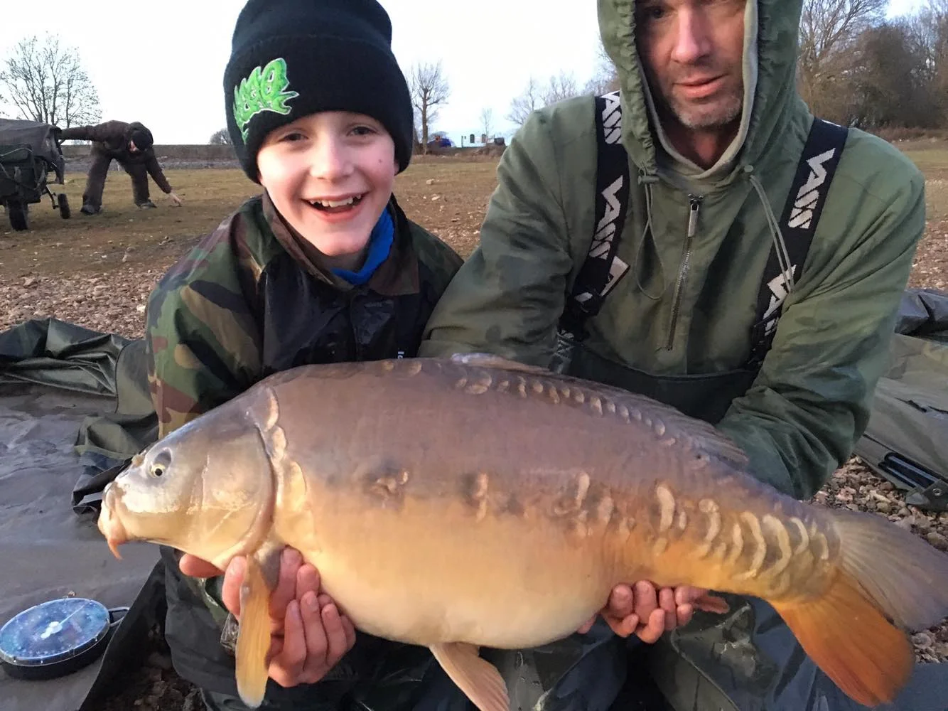Smiles all round as Evan is helped by Jonathan Spaulding