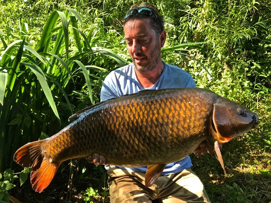 Adam Fisher with a classic Redmire common. Will it ever be fished again?