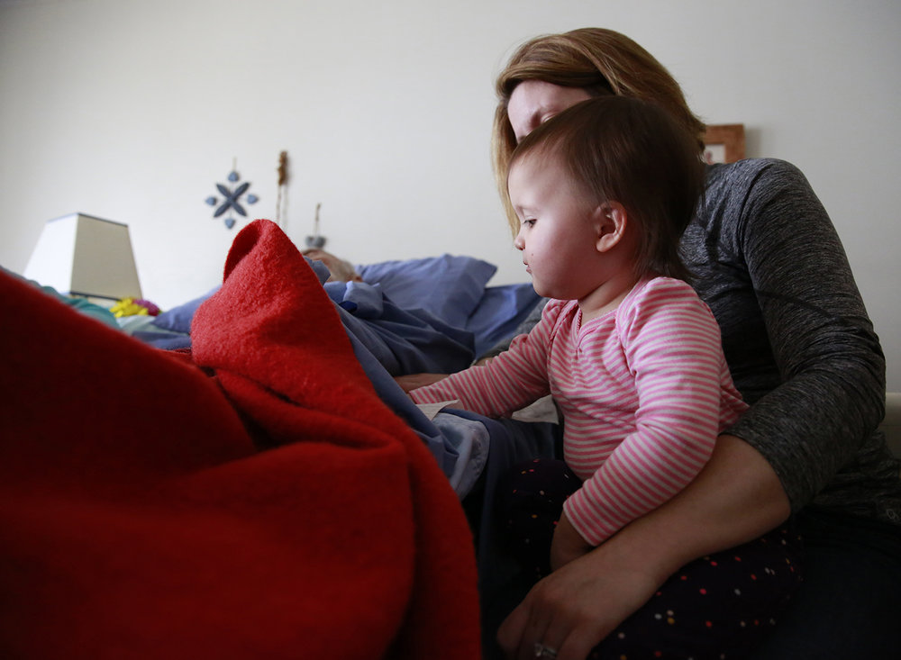 great-granddaughter-holding-grandfather's-hand.jpg