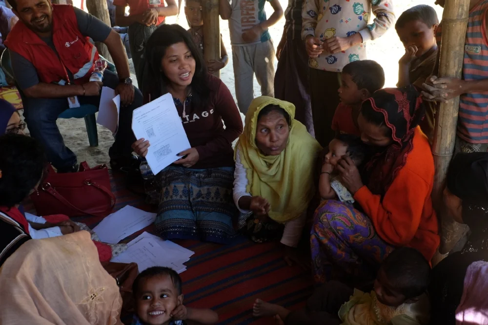  Rohingya caregivers discussing pain points and coming up with design ideas during a co-creation session. 