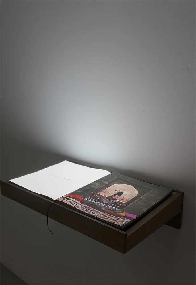 A book for a film (Sayat), 2017. Full HD Video projection on open book. Book; 30.5 x 34 x 2.7 cm, Lectern; 65 x 39.5 x 15 cm