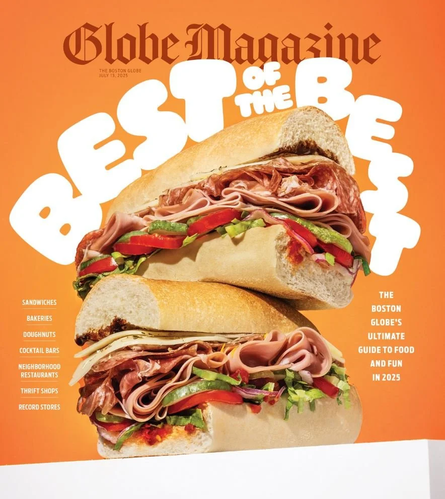 Cover of Boston Globe Magazine featuring a large sandwich with multiple layers of meats, vegetables, and bread against an orange background. The magazine's title is at the top, with additional text about Best of the Best restaurants and food in 2025.