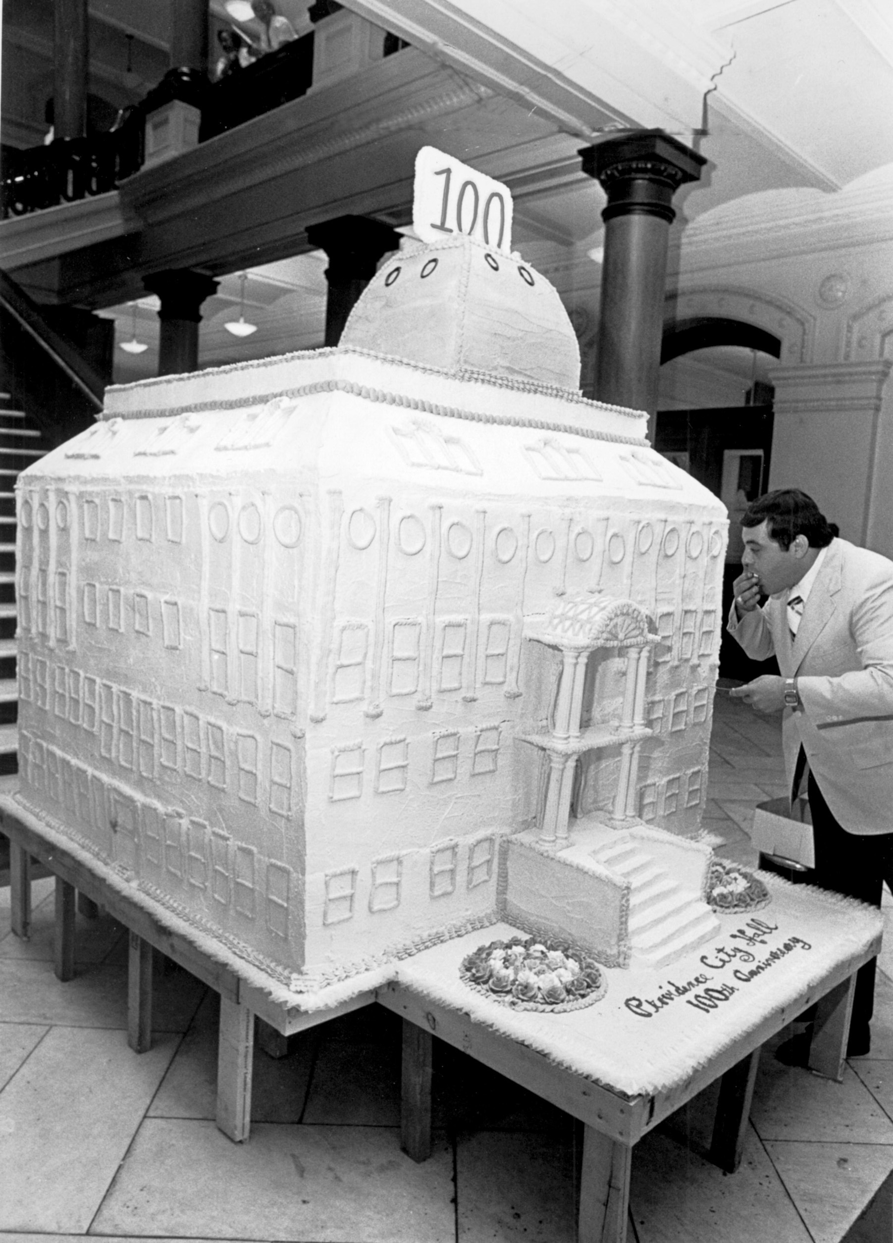 In 1975, Buddy samples a cake made in the shape of City Hall, for the city of Providence's 100th birthday. Providence Journal file photo.