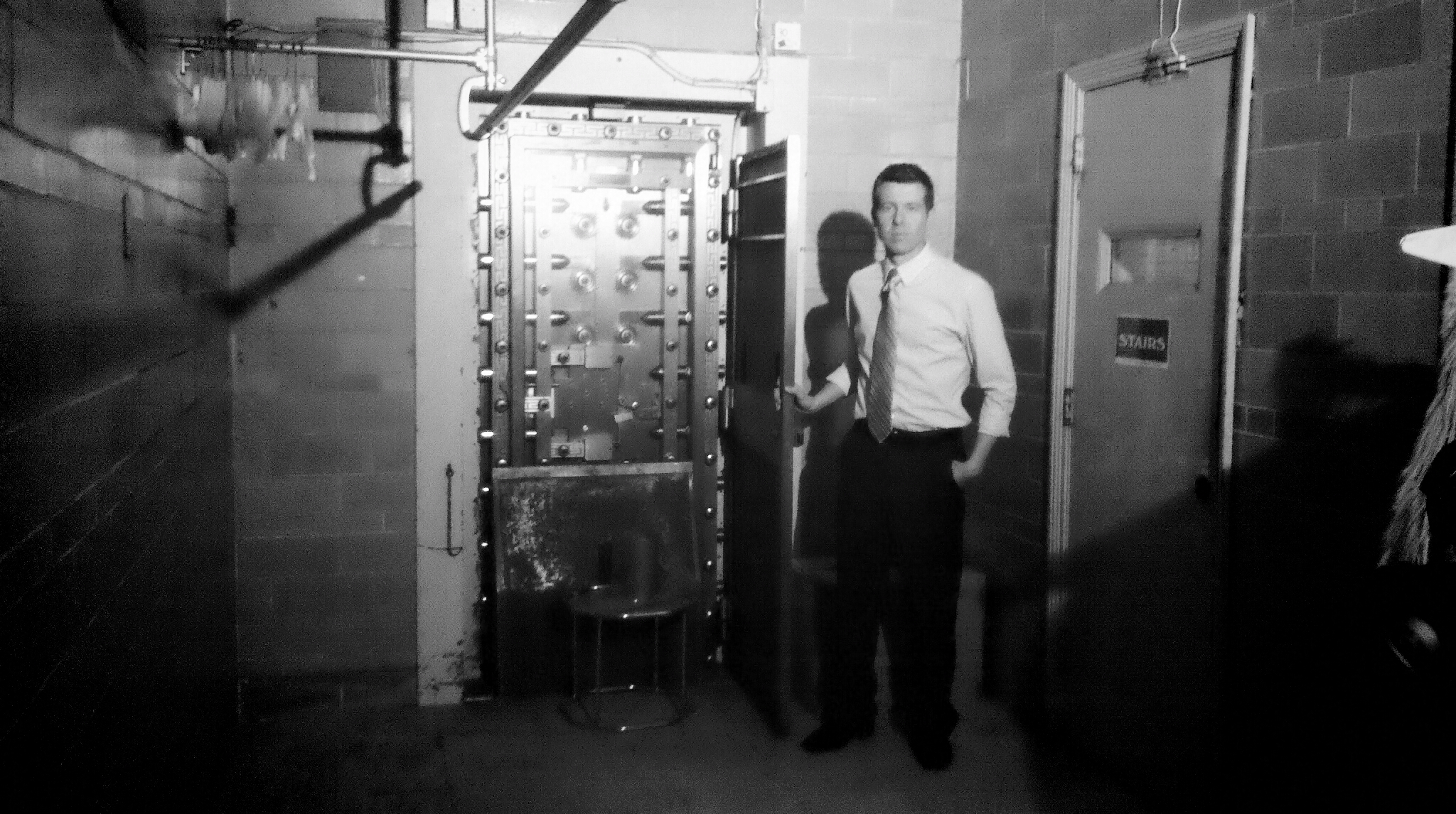 Reporter Tim White next to the door of the Bonded Vault. Courtesy of John Villella/WPRI-TV.