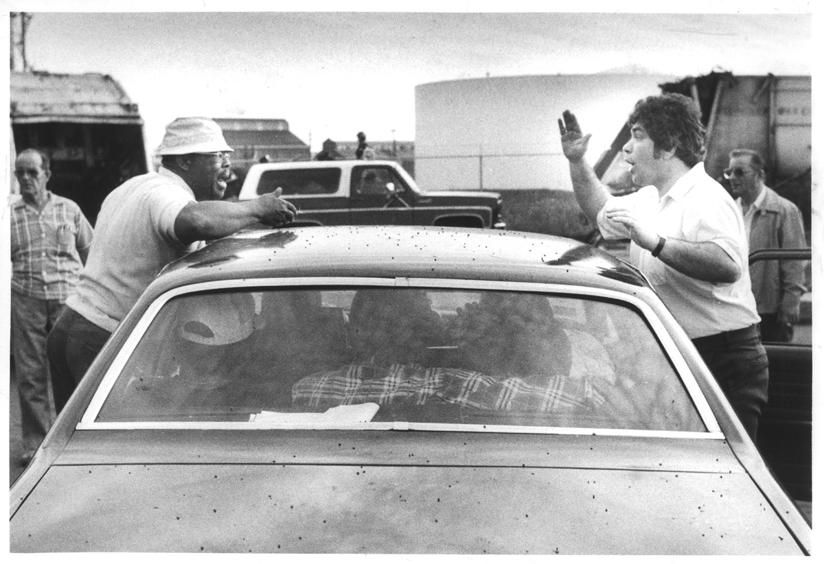 In June 1981, Providence highway superintendent Edward "Buckles" Melise, right, argues with a sanitation worker outside Providence's main garage. Courtesy of the Providence Journal/Peter Morgan.