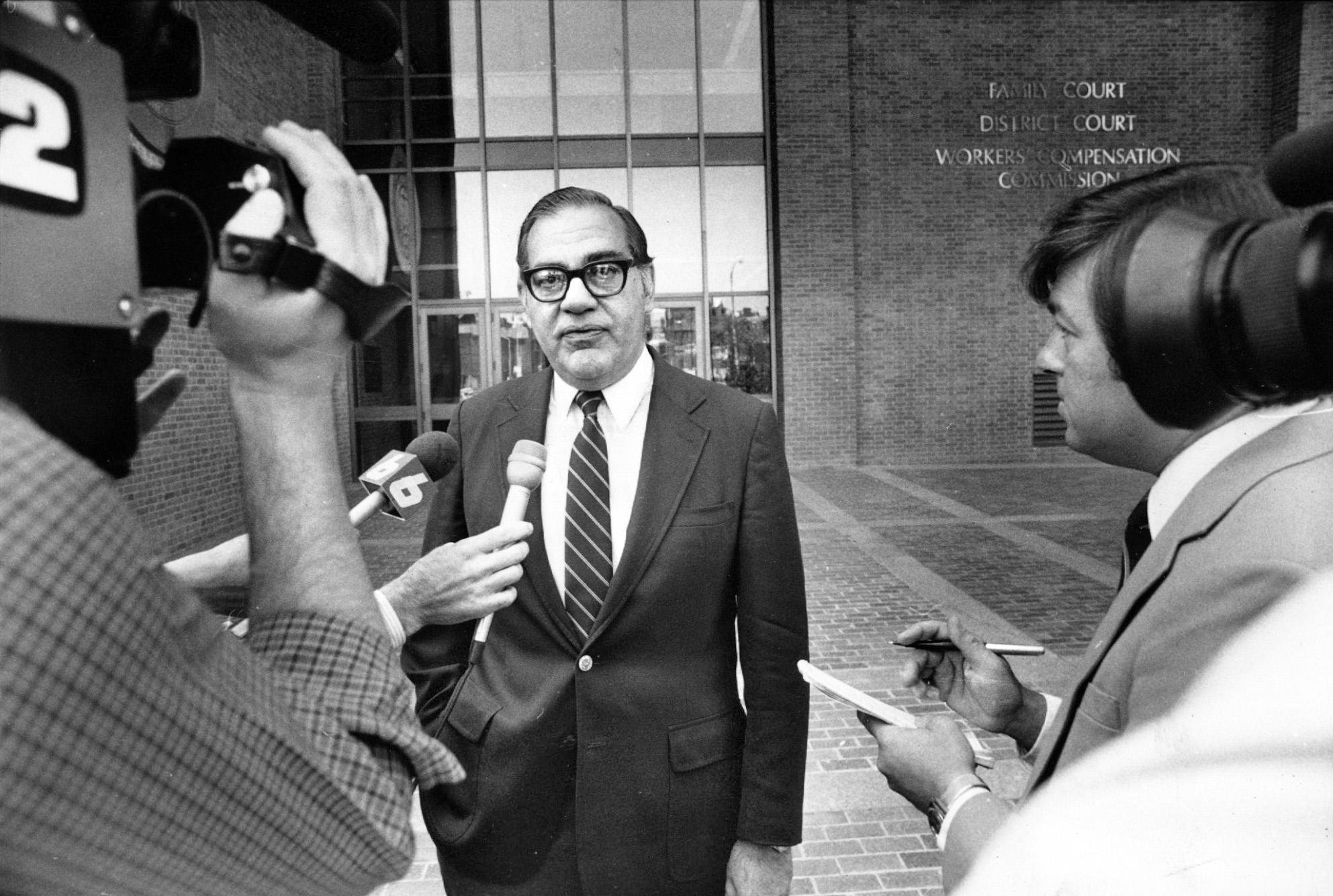 Herbert DeSimone was a friend of Buddy Cianci and Raymond DeLeo. DeSimone, pictured outside the courthouse a few months after the assault, was called on to end the dispute between Buddy and DeLeo. Courtesy of the Providence Journal/Andrew Dickerman .