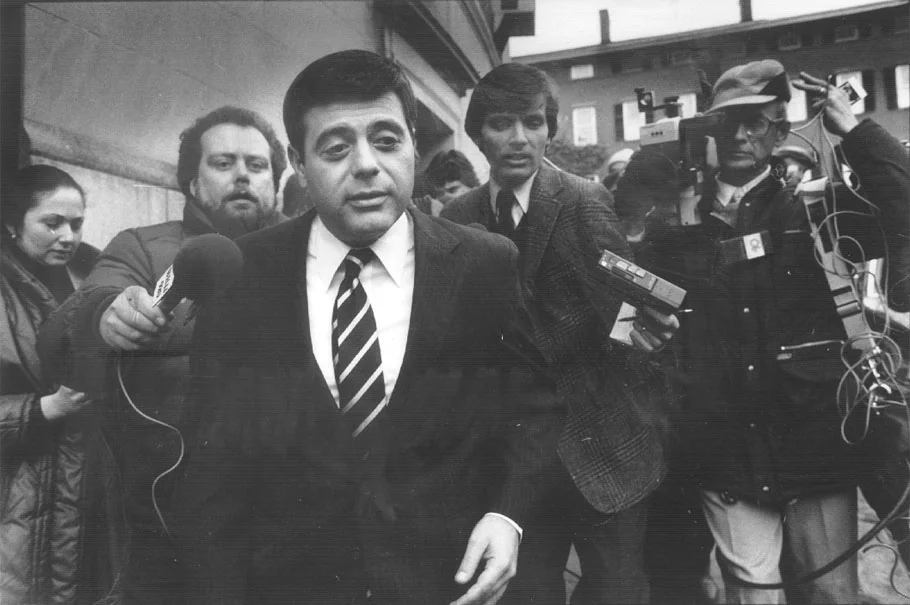 Buddy is pursued by reporters outside Superior Court in Providence. The assault on Raymond DeLeo became a national news story. Courtesy of the Providence Journal/Pamela Price .