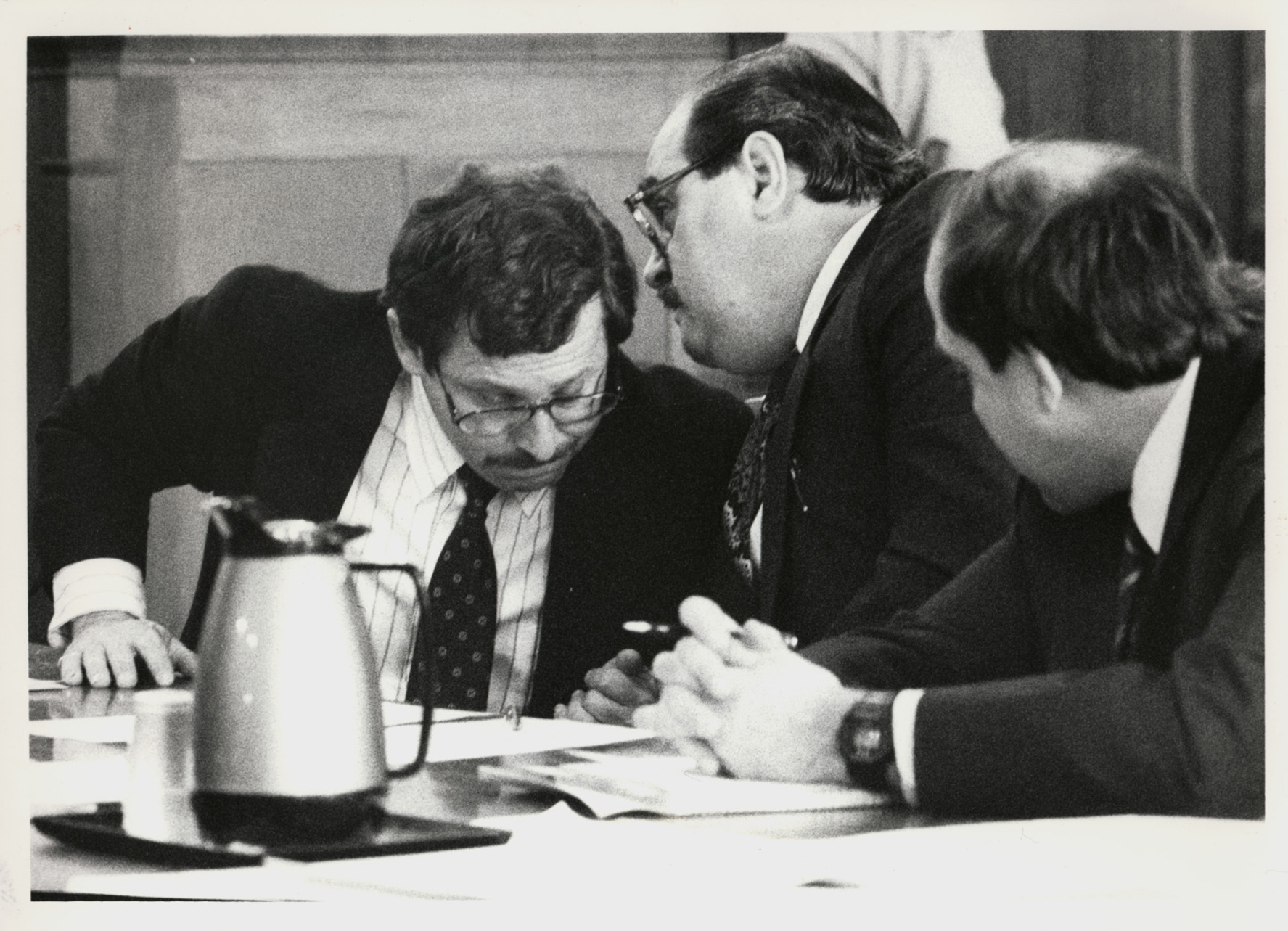Bobo Marrapese, center, confers with lawyer Richard Egbert, left, while another of his lawyers listens in. Courtesy of the Providence Journal/Lawrence S. Millard . 