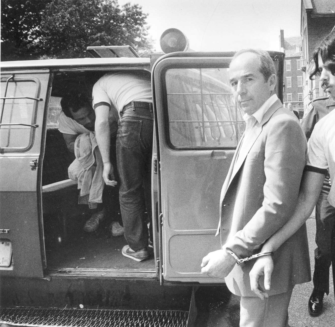 Manocchio is escorted from Superior Court in Providence, where he was found guilty on several counts in connection with the 1968 gangland slaying of Rudolph Marfeo and Anthony Melei. Courtesy of The Providence Journal/Richard Benjamin.