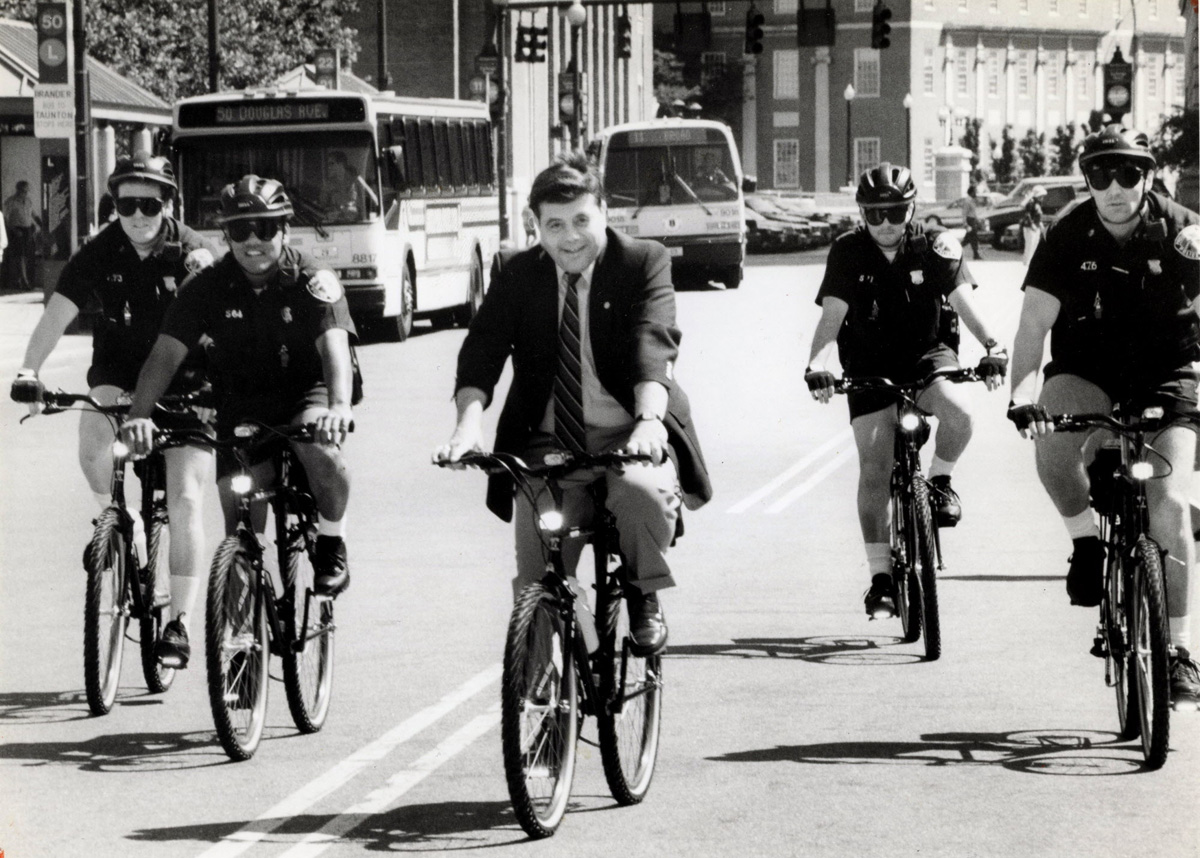 Buddy leads a bicycle brigade of police officers on mountain bikes around Kennedy Plaza in June 1991. Courtesy of The Providence Journal/Sandor Bodo.