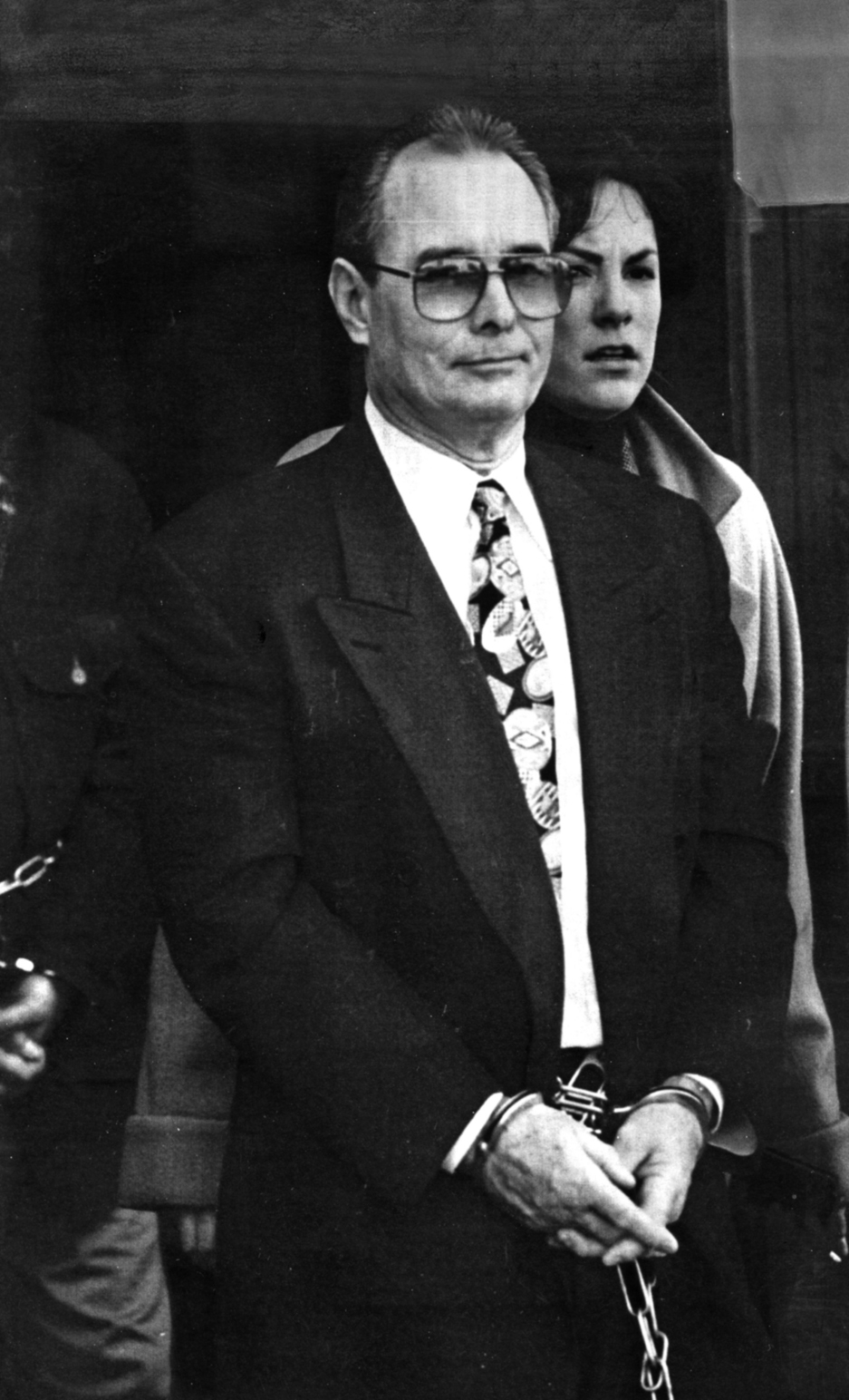 Ouimette is escorted out of Federal Court after being sentenced to life in prison without parole on February 1, 1996. Ouimette was known for his flashy outfits and lifestyle; retired state police captain Brian Andrews described him as the "Prince of Atwells Avenue." Courtesy of The Providence Journal/David Carson.