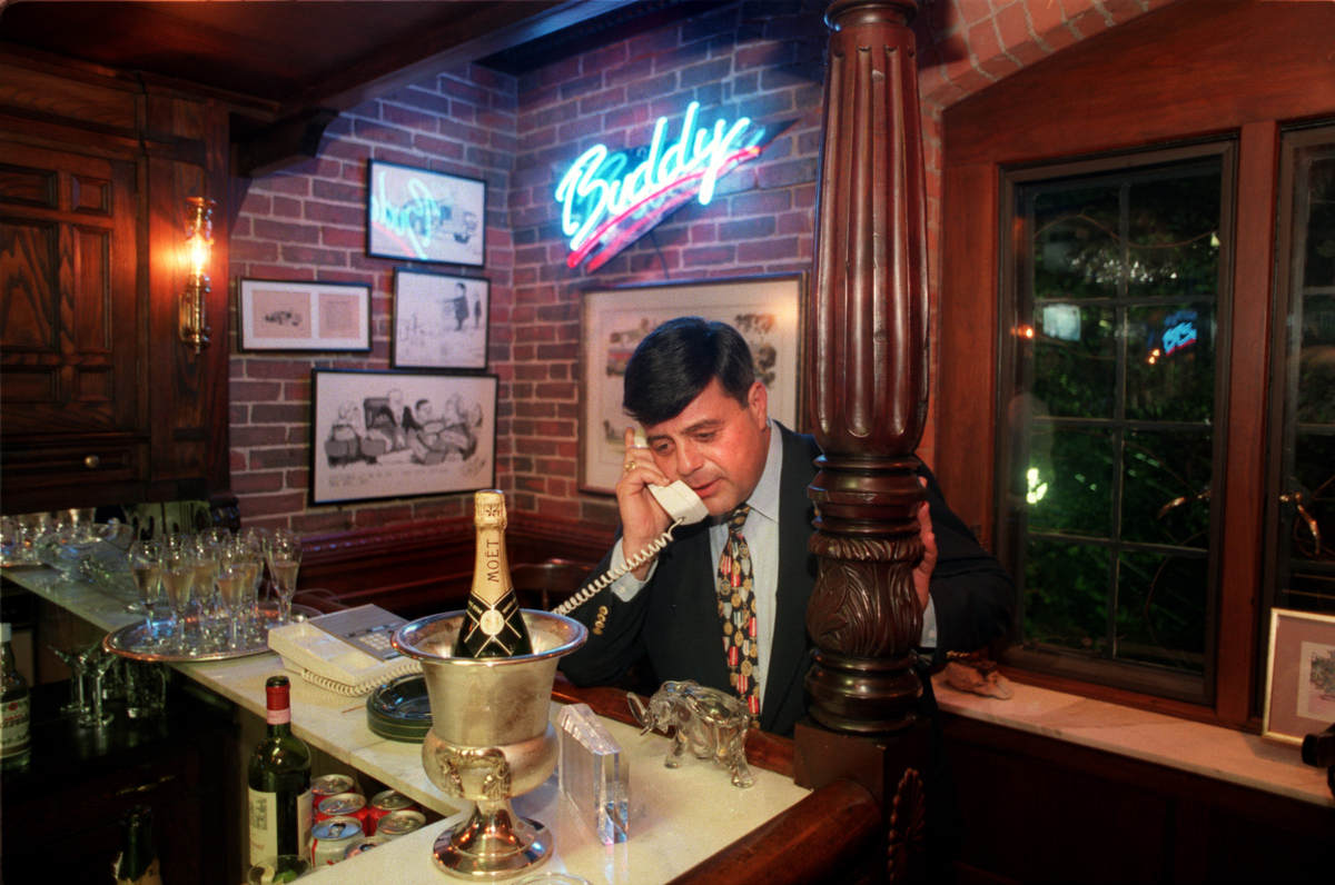 On election night in November 1994, Buddy Cianci takes a call at the bar in his home at 33 Power Street. Courtesy of The Providence Journal/William K. Daby.