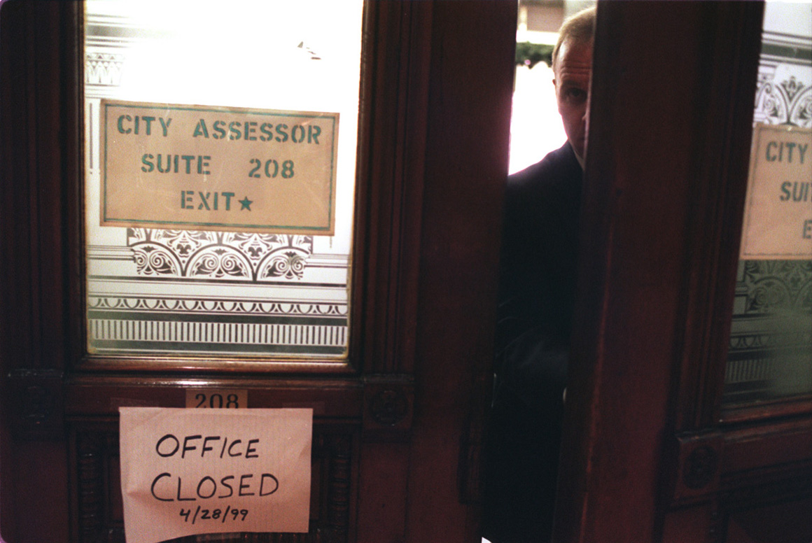 An FBI agent leaves the Tax Assessor's Office at Providence City Hall. In April 1999, investigators descended on five city offices with search warrants. Courtesy of The Providence Journal/Bob Thayer.