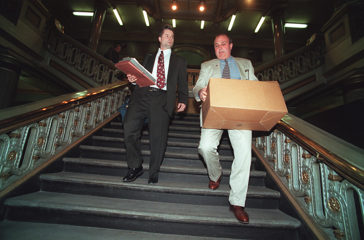 FBI agents leave Providence City Hall carrying boxes of evidence taken from the Tax Assessors office. Courtesy of The Providence Journal/Ruben W. Perez.