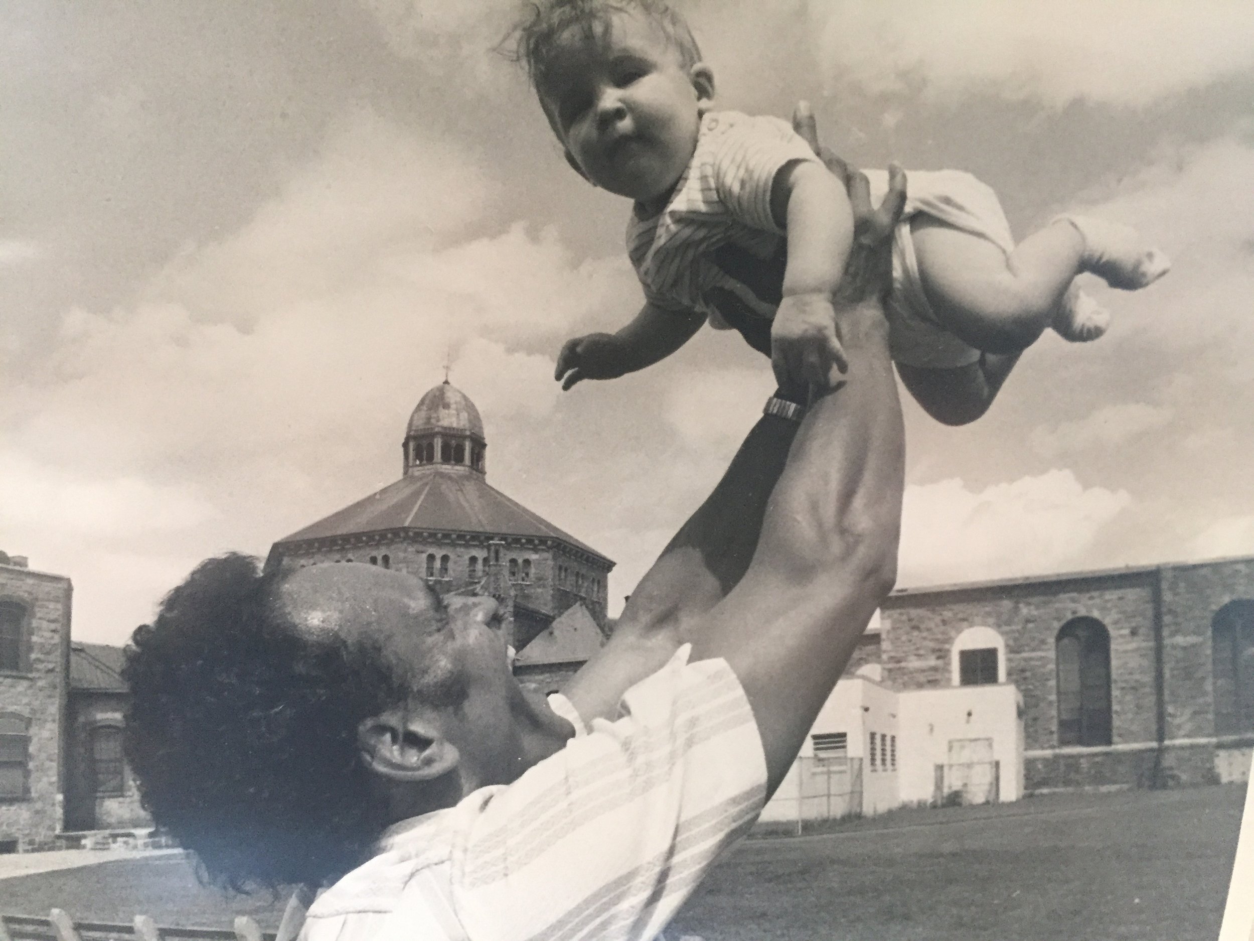 Ralph DeMasi struggled to remain close to his family as he cycled in and out of prison. Here, he plays with one of his children outside of the Adult Correctional Institutions. Courtesy of Ralph DeMasi.