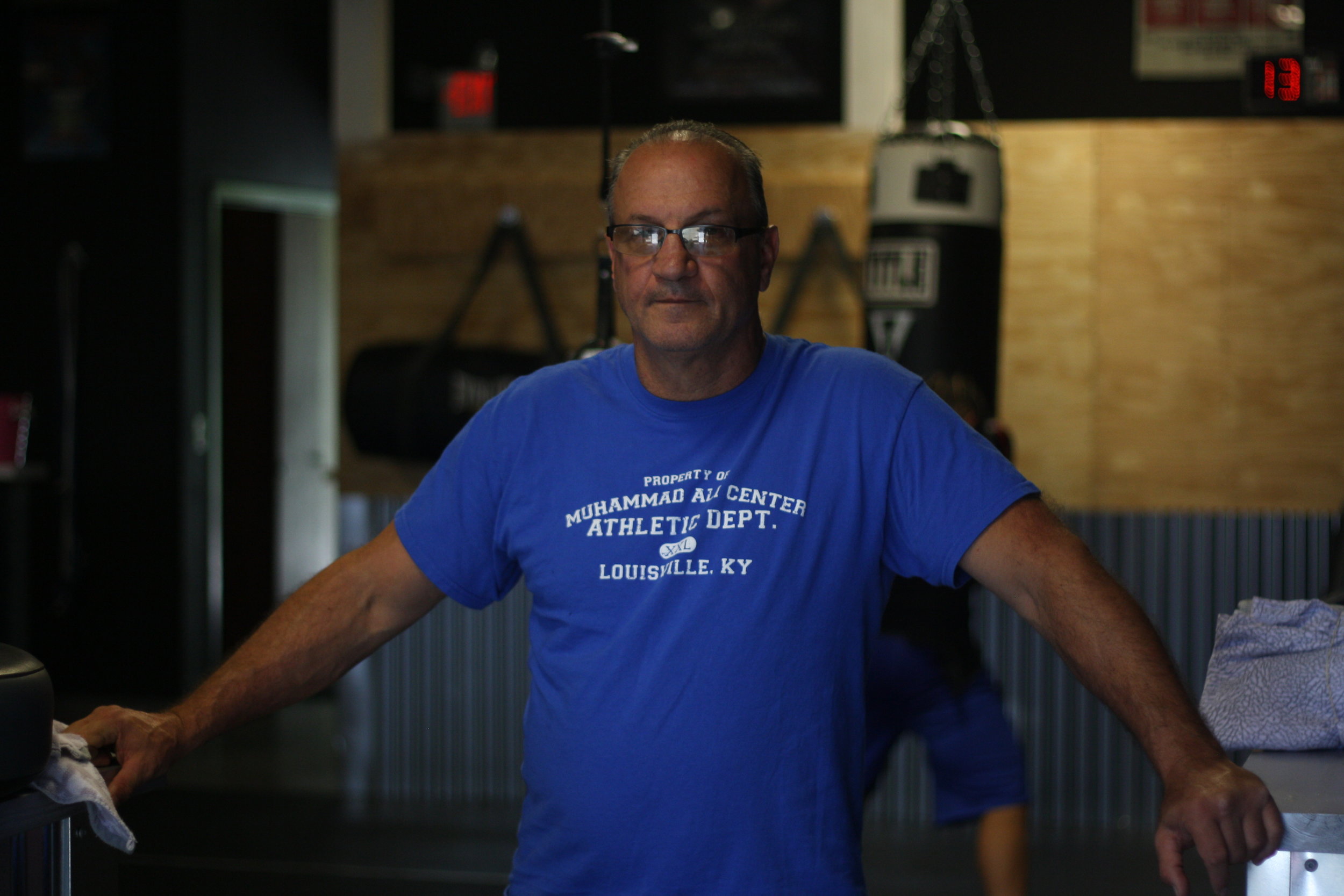 Working with boxing trainer Peter Manfredo, above, Jarrod learned that the rough-and-tumble world of street fighting was very different from boxing. Manfredo tried to instill in Jarrod a sense of discipline and focus. Photo by Rob Szypko.