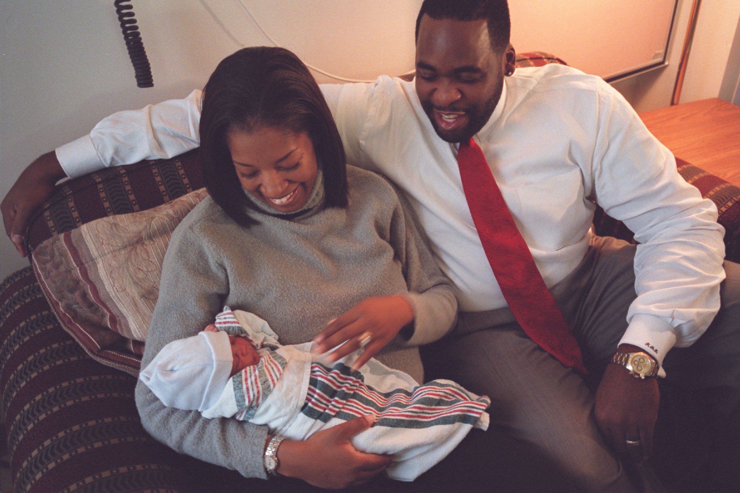 Carlita and Kwame Kilpatrick hold their new son, Jonas, just weeks after Kwame was first elected mayor in 2001. Courtesy of the Detroit Free Press.