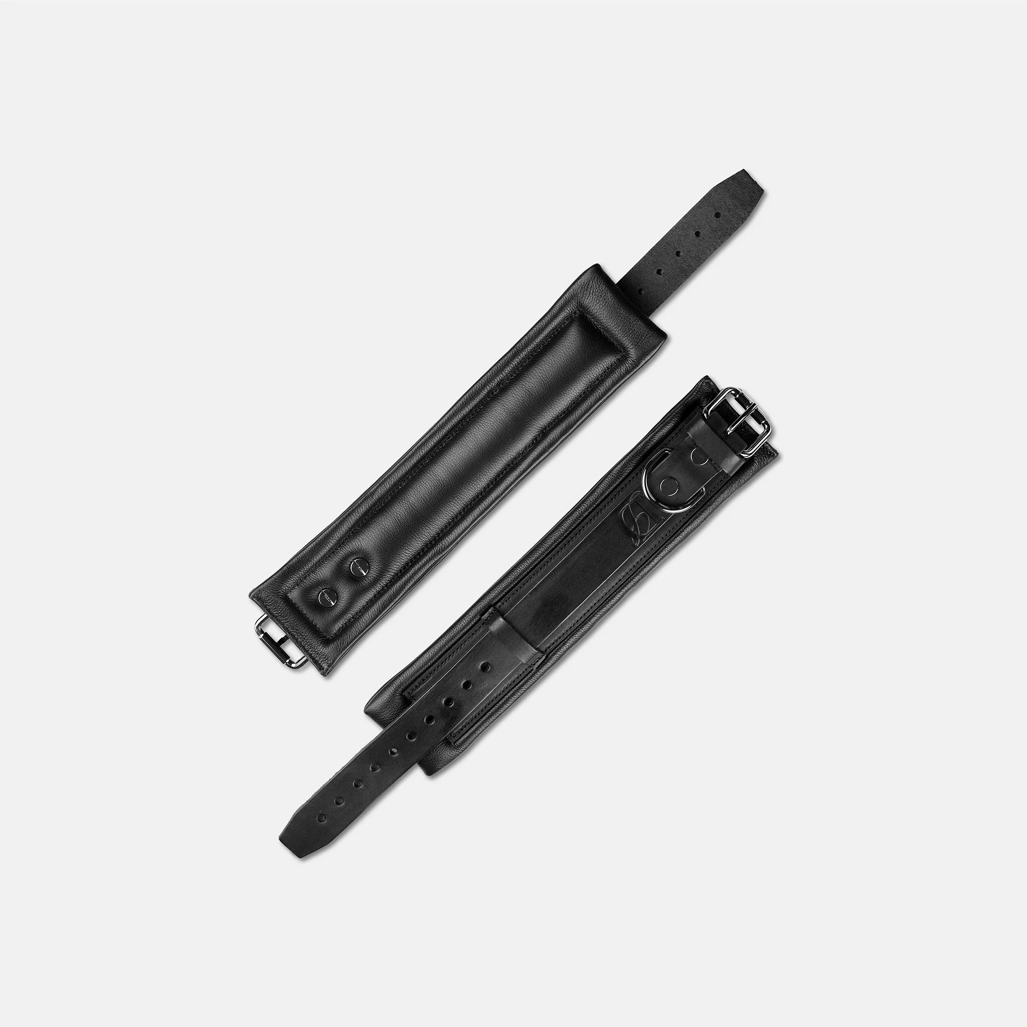 Interior view of plush padded black leather wrist cuffs for comfortable extended wear