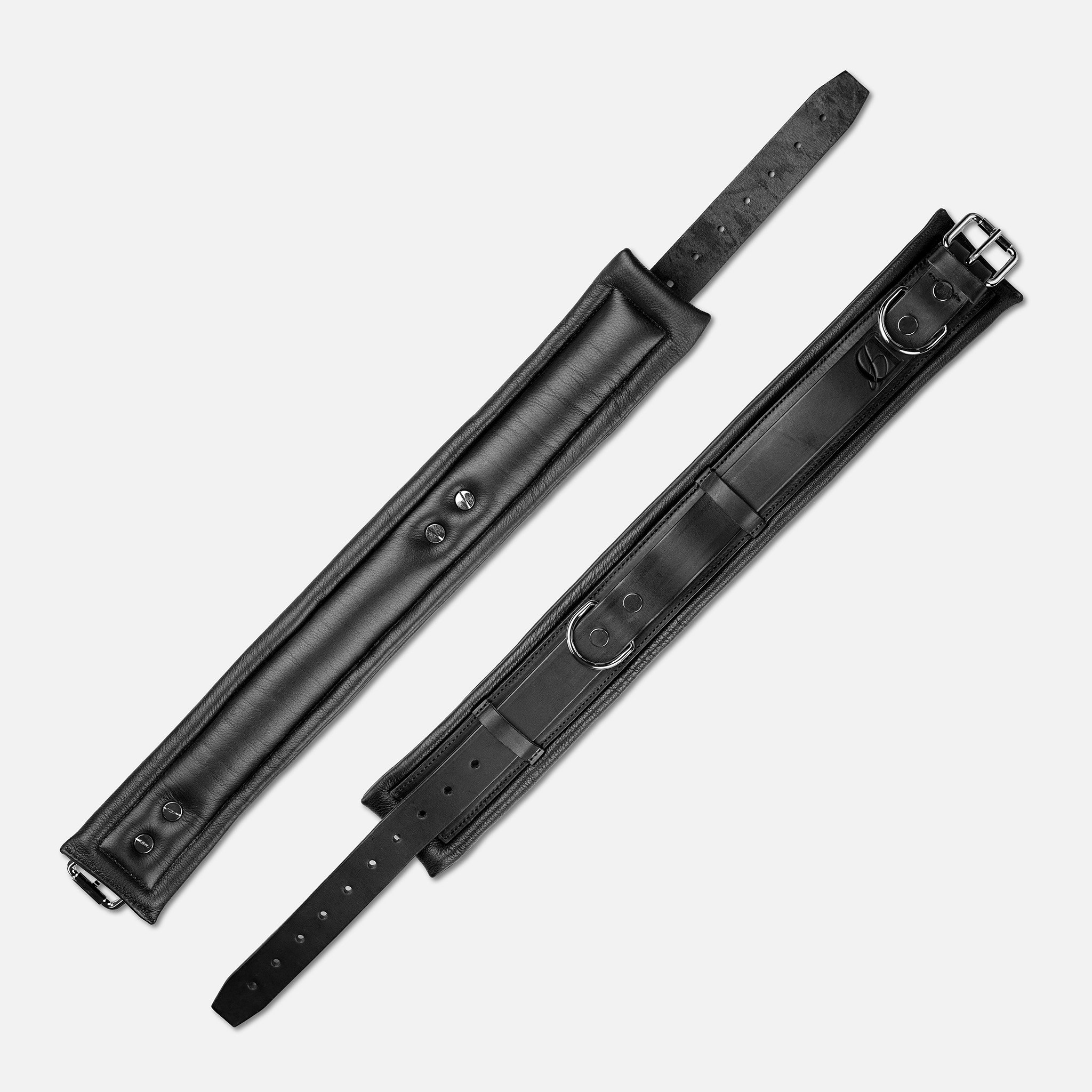 Plush padded interior of black leather BDSM collar for neck comfort