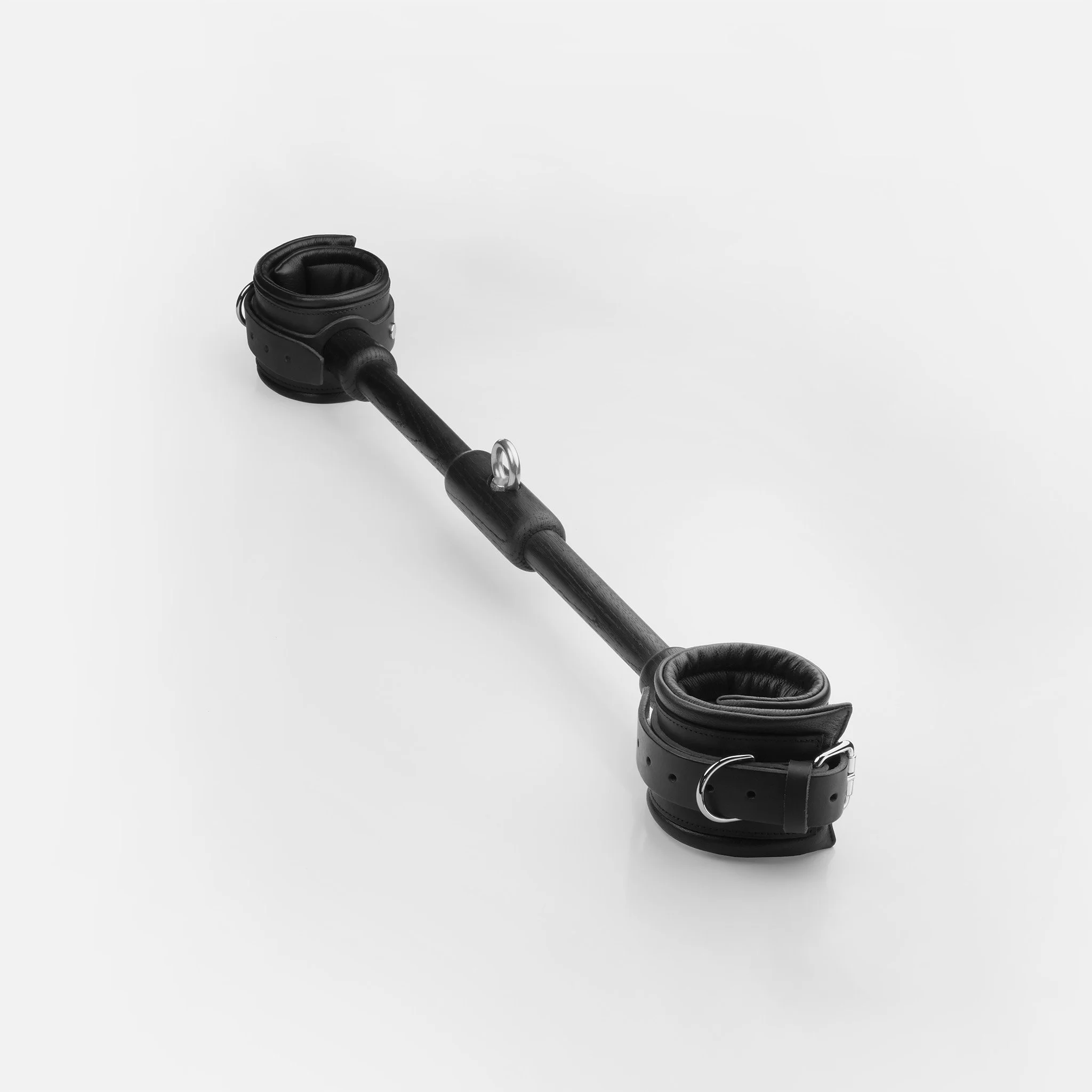Turned oak spreader bar with black padded leather ankle cuffs and detachable centre eyelet