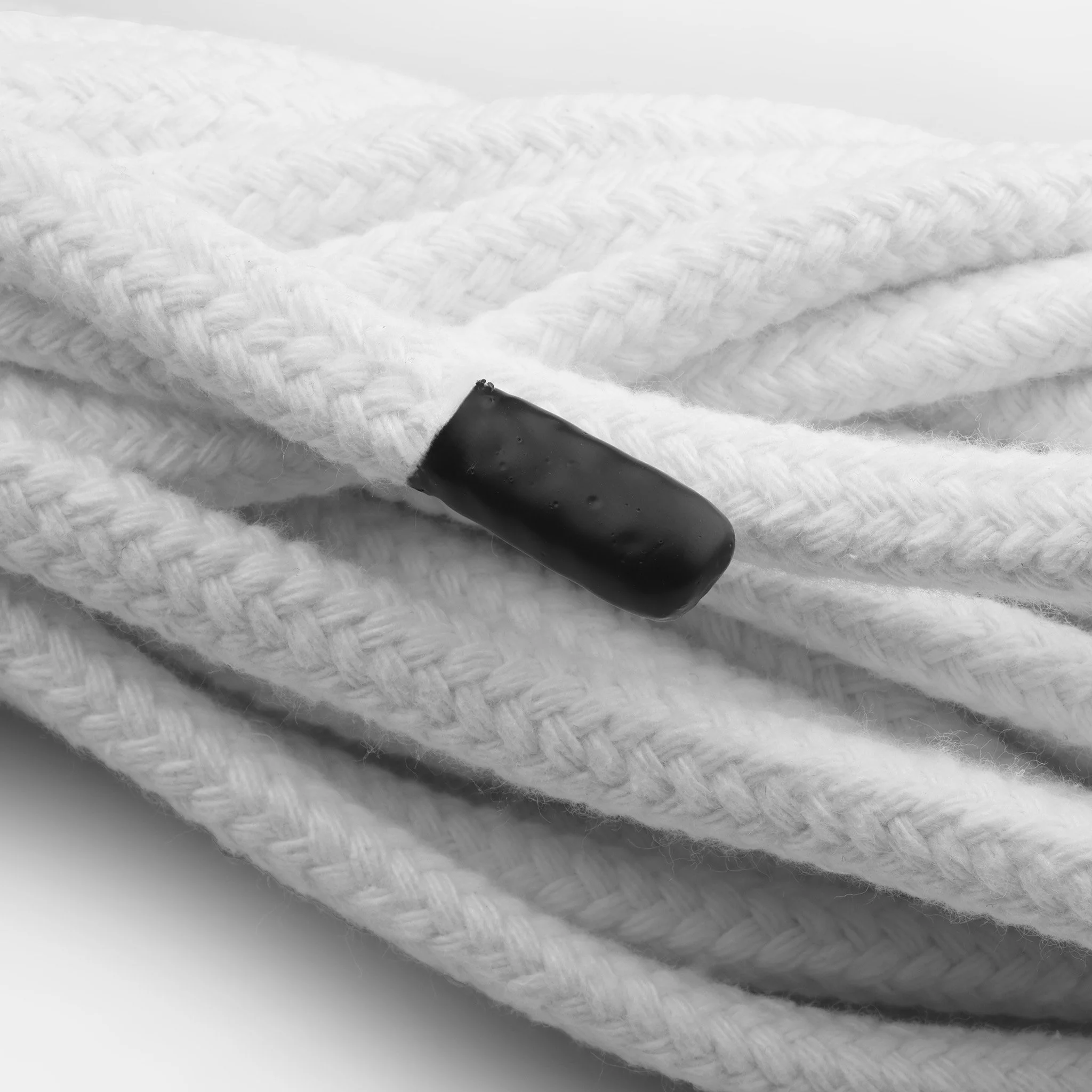 Finished ends and coiled 10 mm bleached cotton bondage rope