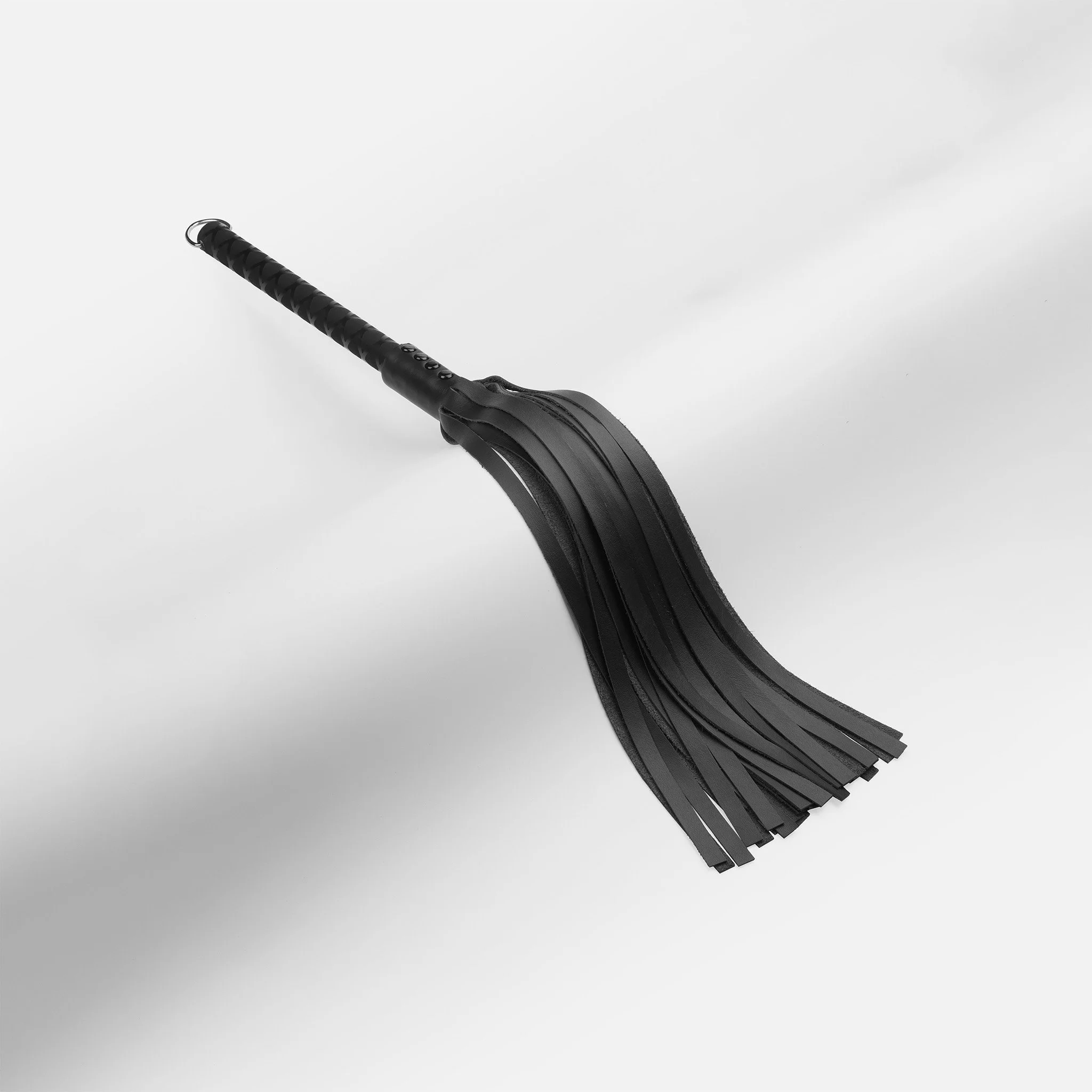Lightweight black leather flogger with 30 soft tails and long sure-grip handle