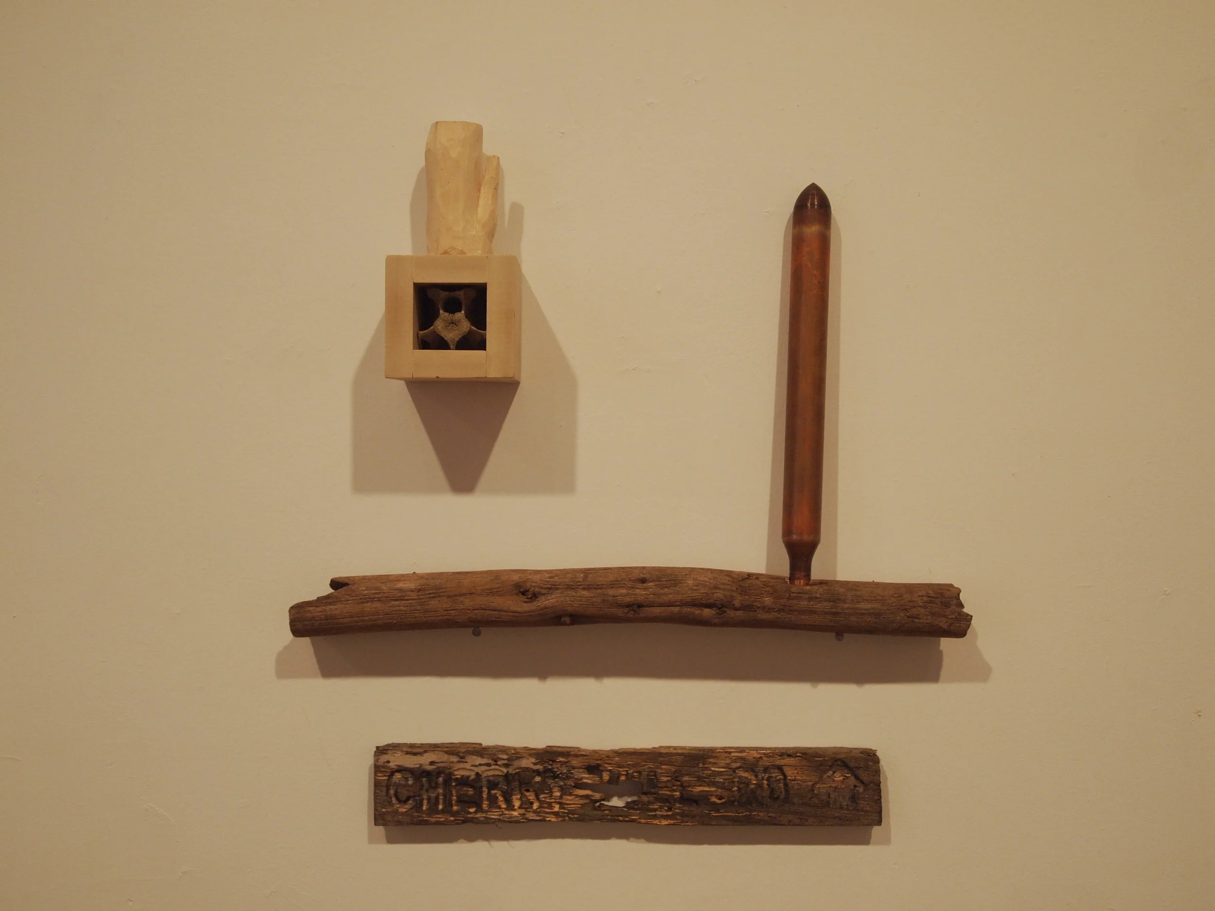  Carved wood, vertebrae, found copper chamber, found wood 