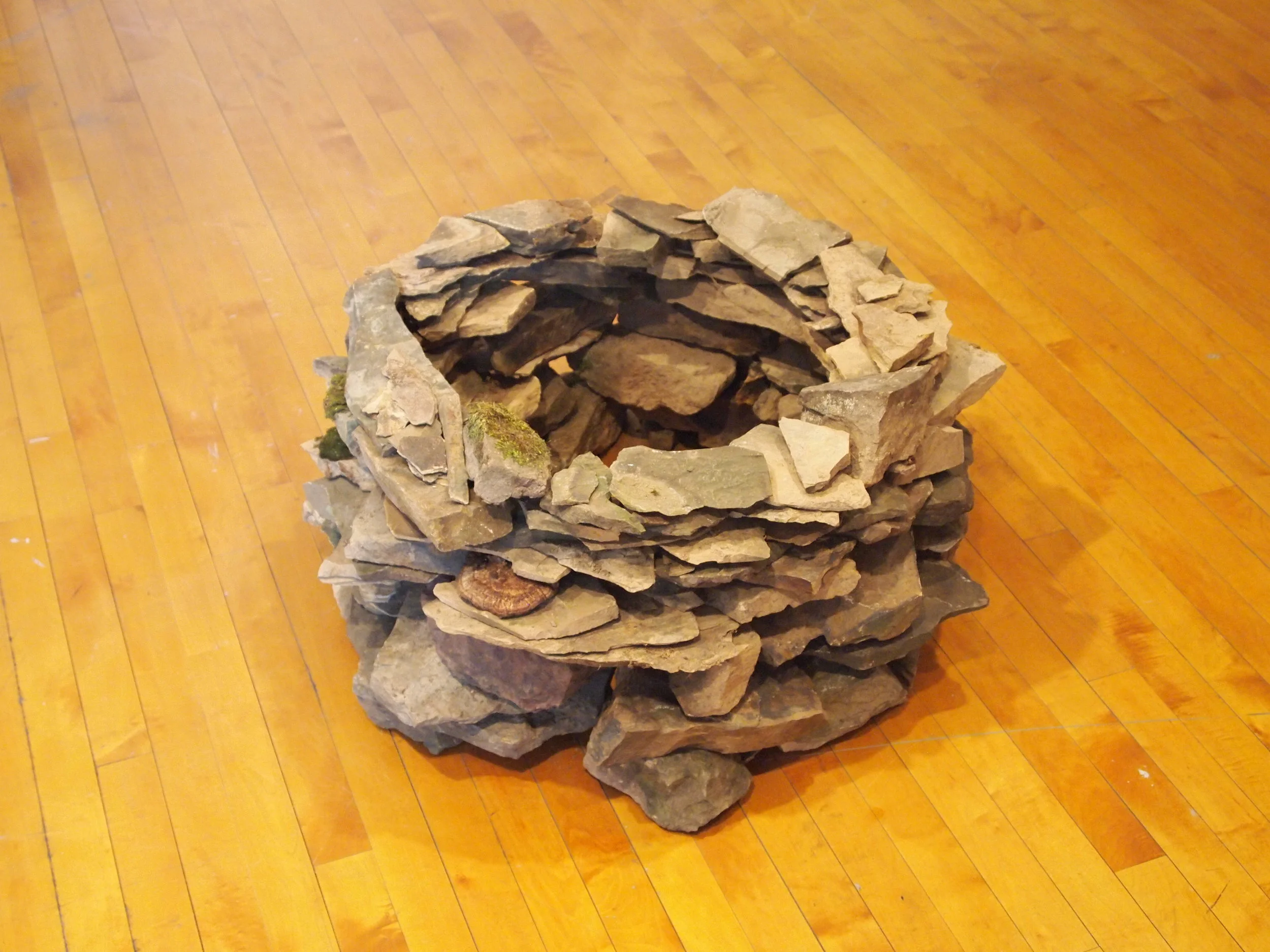  Collected slate rocks, arranged as continuous wall 