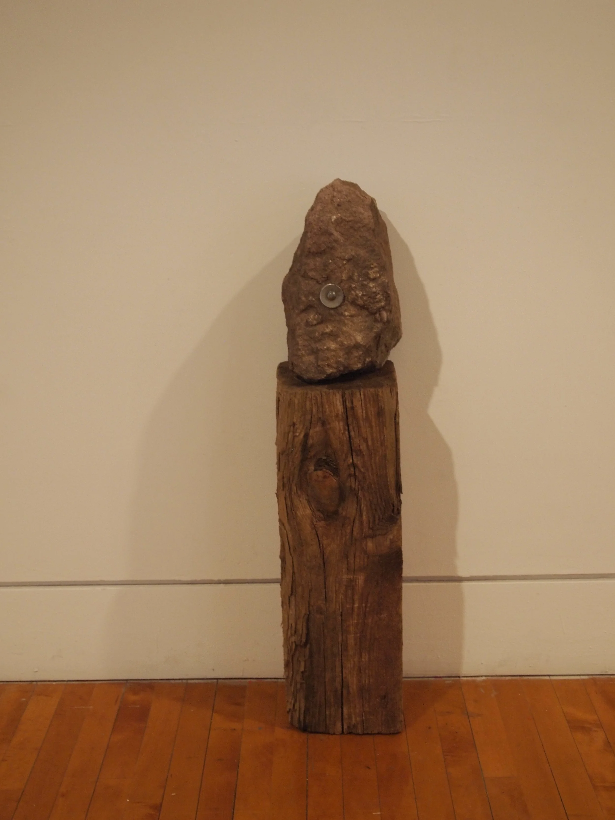  Found rock with metal, found wood pedestal 